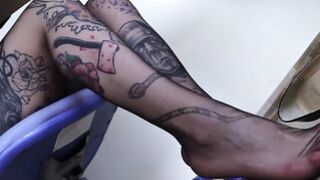 Tattoed redhead secretary shows off nylon feet