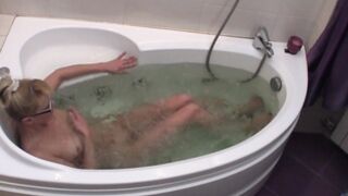 My naughty Girlfriend enjoying a refreshing moment naked in the bathtub
